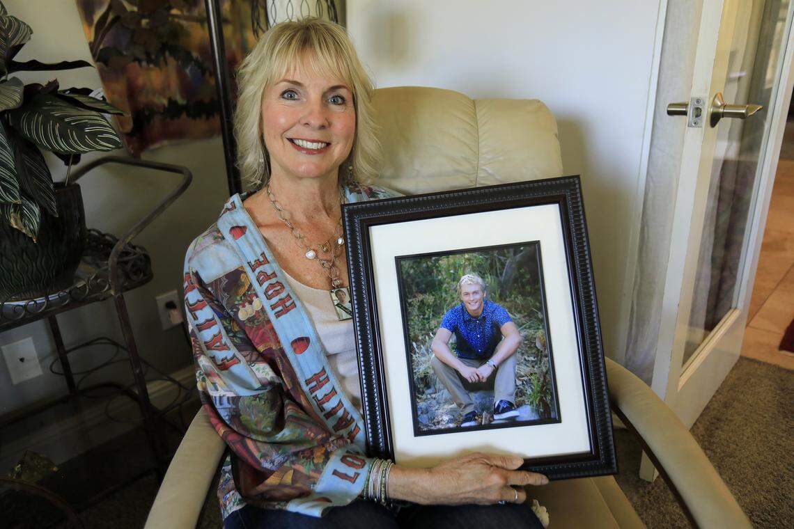 Lauri Strain of Templeton holds a photo of her son Ian, who died by suicide after being diagnosed with cannabis-induced psychosis and bipolar 1. Strain has started a nonprofit, HOPE with I.A.N., to spread awareness and education about suicide and mental health.